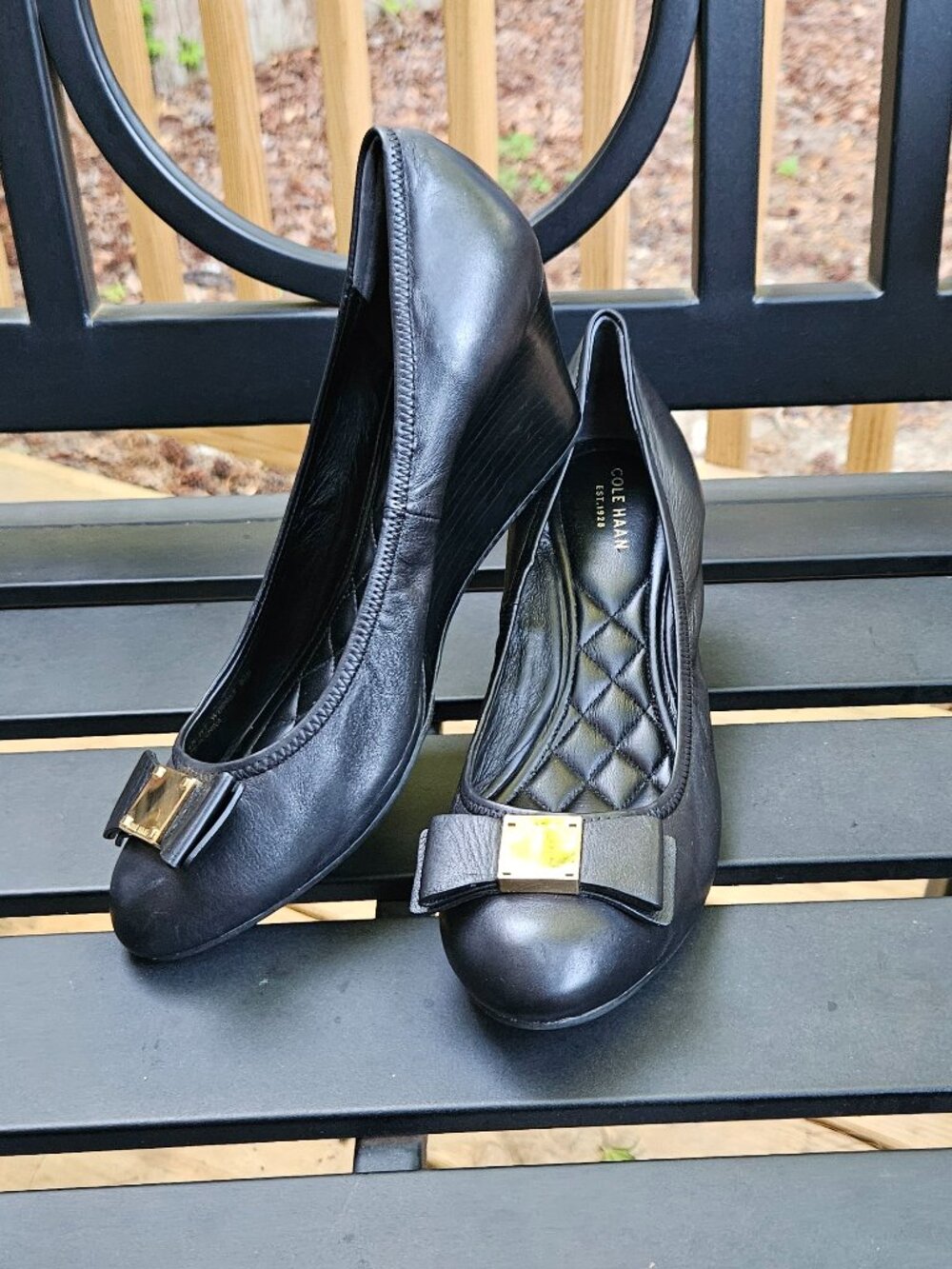 Cole Haan Black Leather Wedge Pumps with Gold Bow Accent